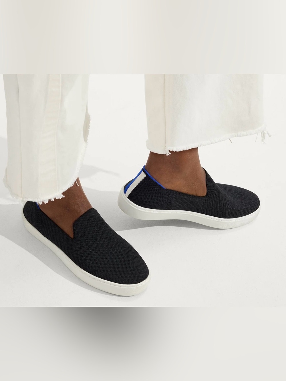 Rothy's Black Slip-On Flats with Blue Heel Trim